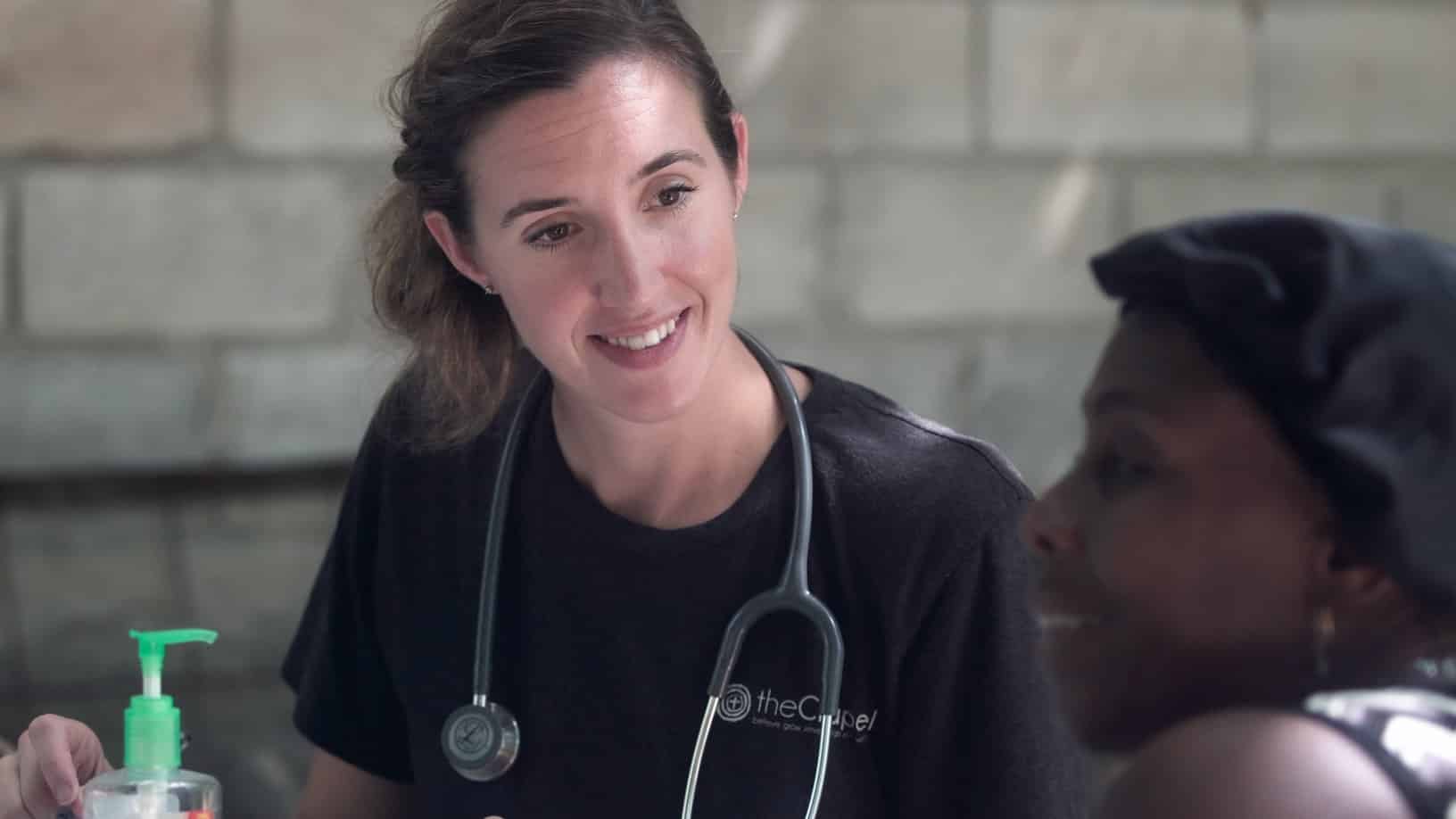 a health care worker with a stethoscope around her neck